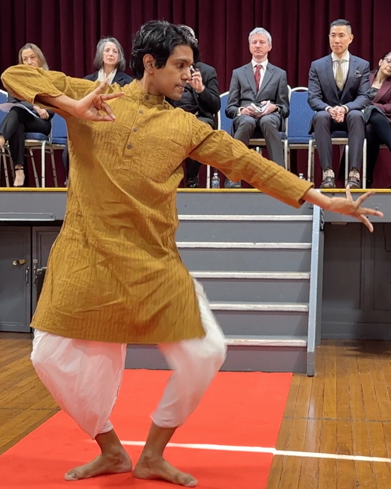 A male student performs a traditional Indian dance