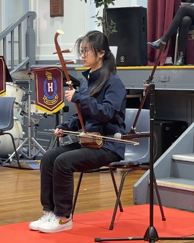 Female student performs on the erhu
